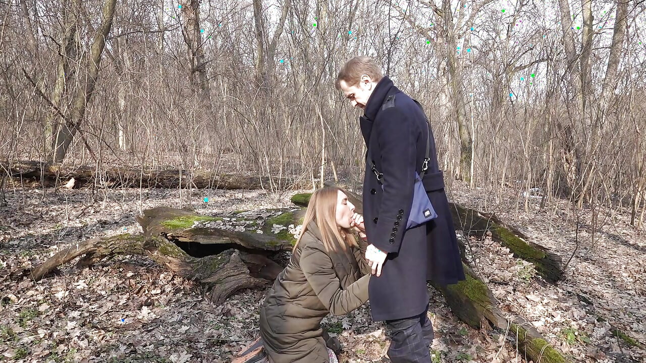 In the forest, a girl got on her knees and start sucking cock