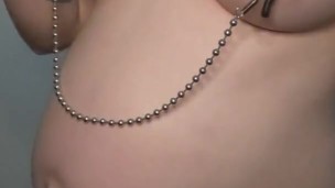 Pregnant slut fingers self with nipple clamps