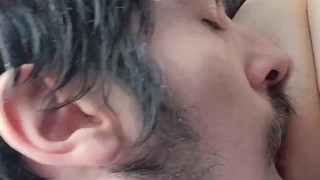 Playing and sucking wife’s tits on car ride